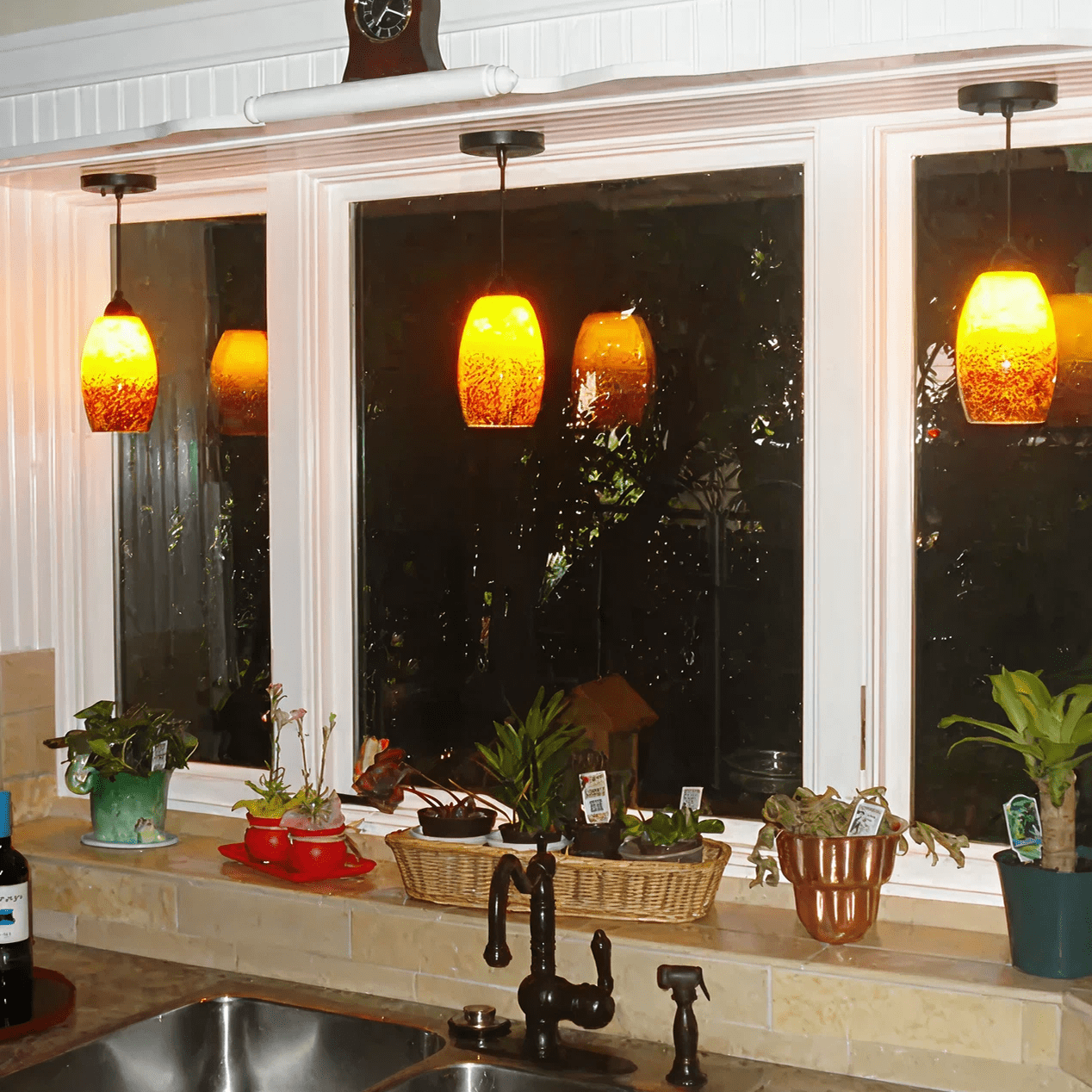 Kitchen window with hanging pendant lights